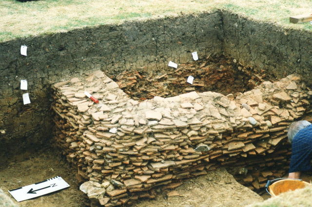 Trench with medieval tile kiln walls and context markers